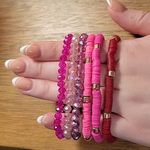Set of 6 bracelets in pink shades. 3 heishi style and 3 beaded.